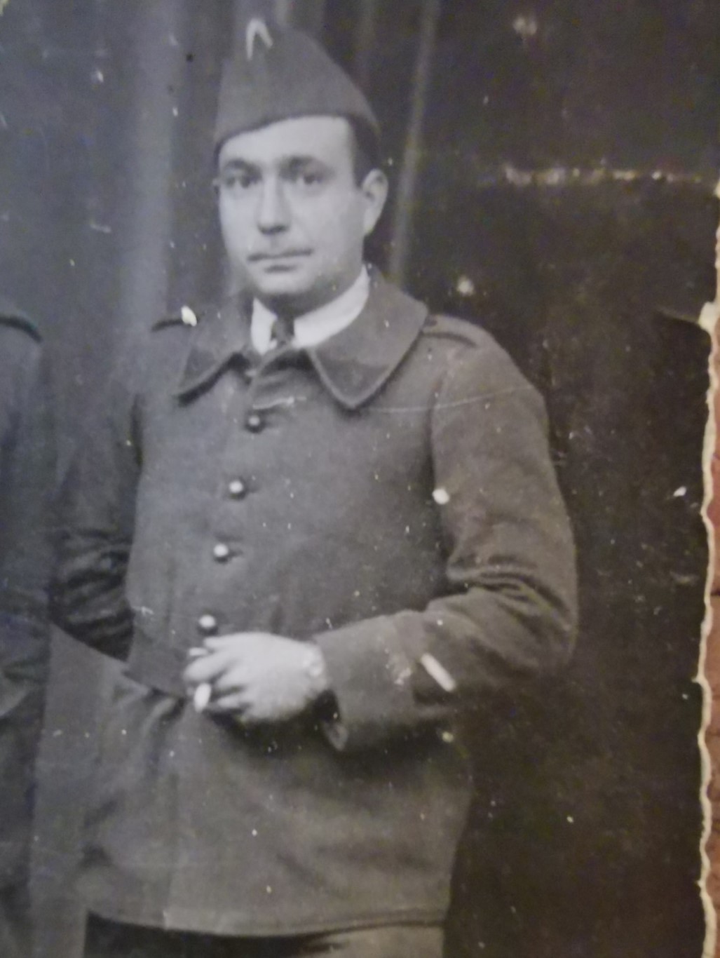 Portrait photo showing Paul Hemsi in uniform, smoking a cigarette.